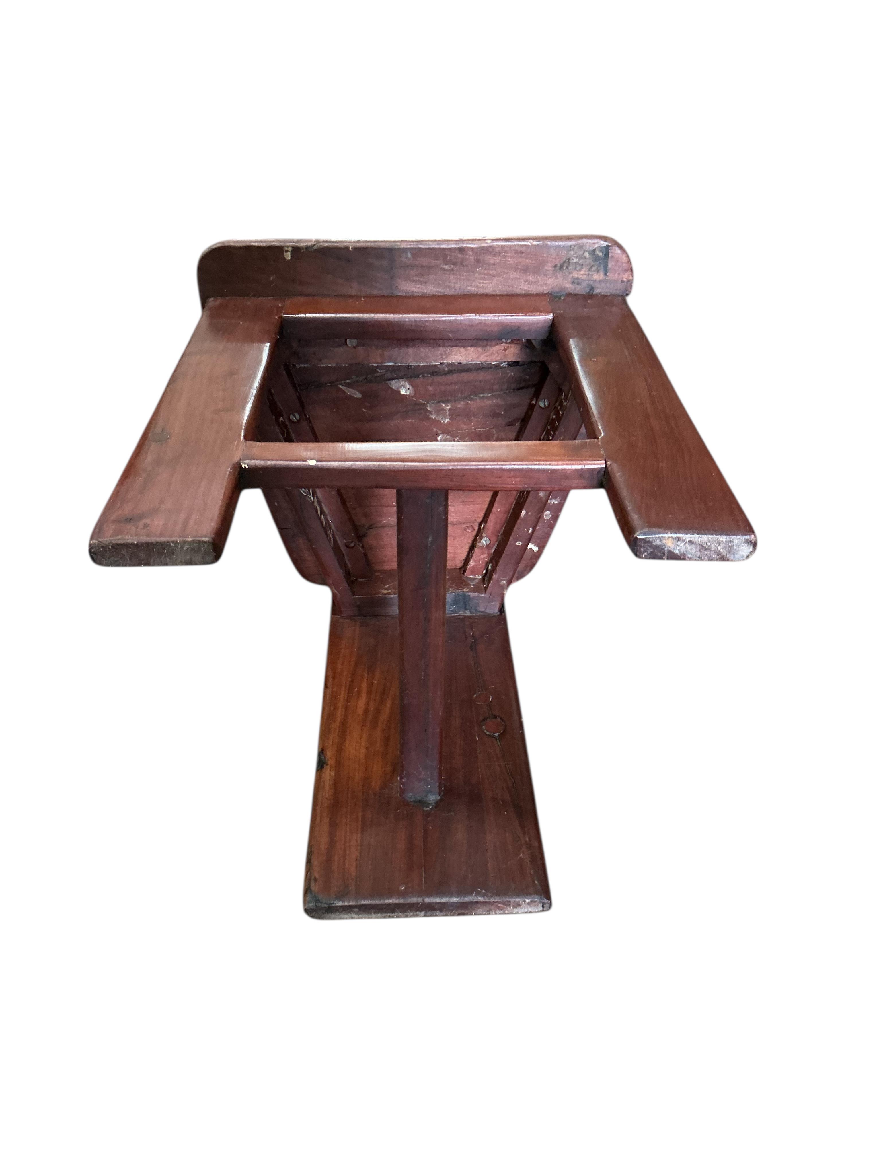 A Zimbabwean reclaimed Jarrah railway sleeper hardwood circular pedestal dining table, diameter 170cm, height 75cm and eight chairs by Rail Antiques, Harare, each piece stamped Rail Antiques